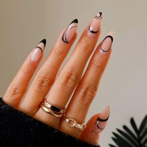 Woman's hand with black negative space nail design